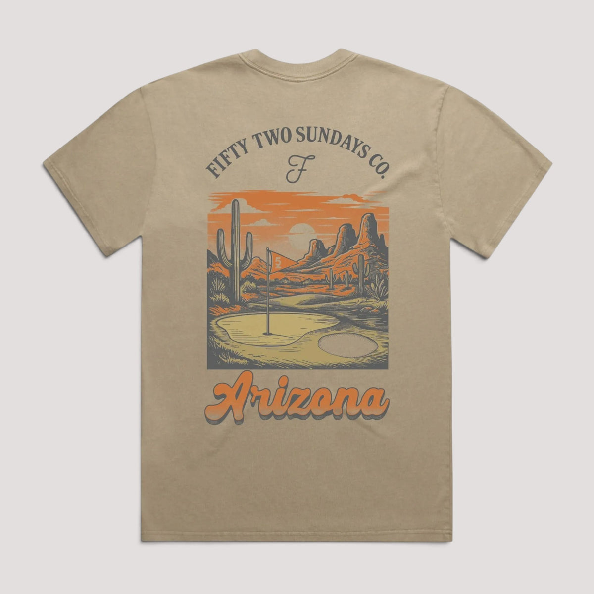 A beige short-sleeve t-shirt with a graphic print on the front. The graphic features a desert landscape with cacti and mountains under an orange sky, with the text 'FIFTY TWO SUNDAYS CO' above and 'Arizona' below.