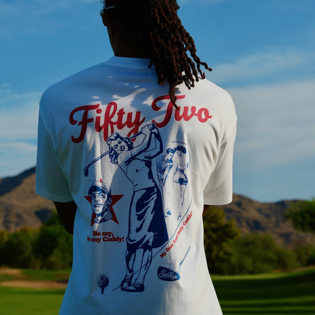Close-up of the Be My Caddie Tee's full back graphic — "Fifty Two" script, vintage golfer illustrations, and "Be My, Be My Caddy!" text.