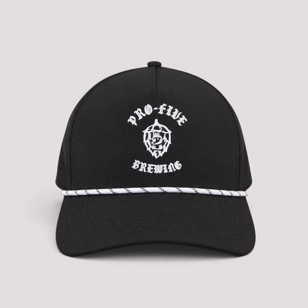 A black golf hat with white silicone logo text reading 'PRO-FIVE BREWING' and a white rope detail across the front, shown on a light gray background.